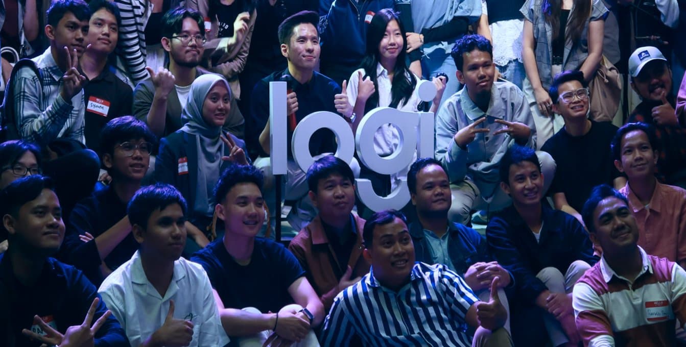 Group photo around a Logitech logi sign