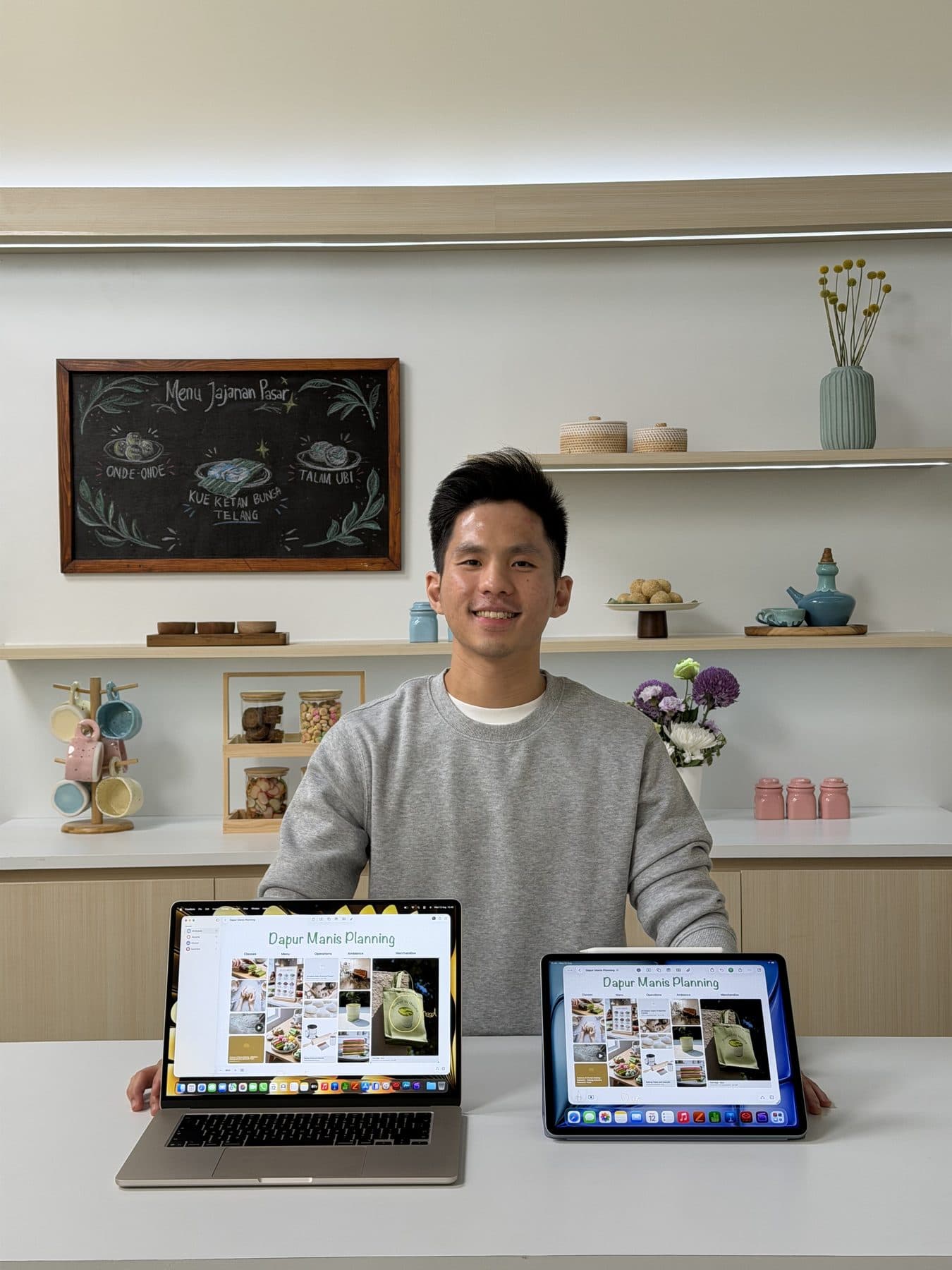 Edward working at a desk with a laptop and tablet