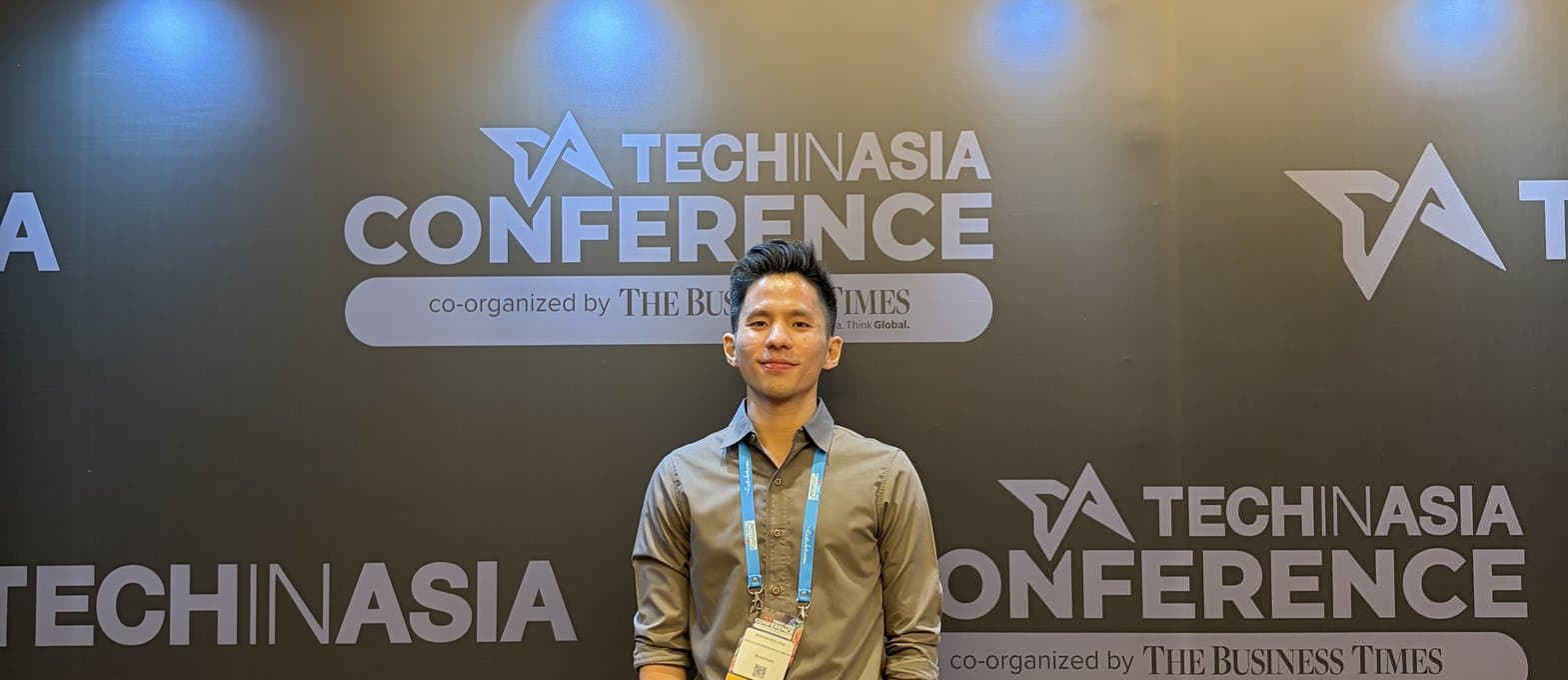 Edward in front of the Tech in Asia Conference wall