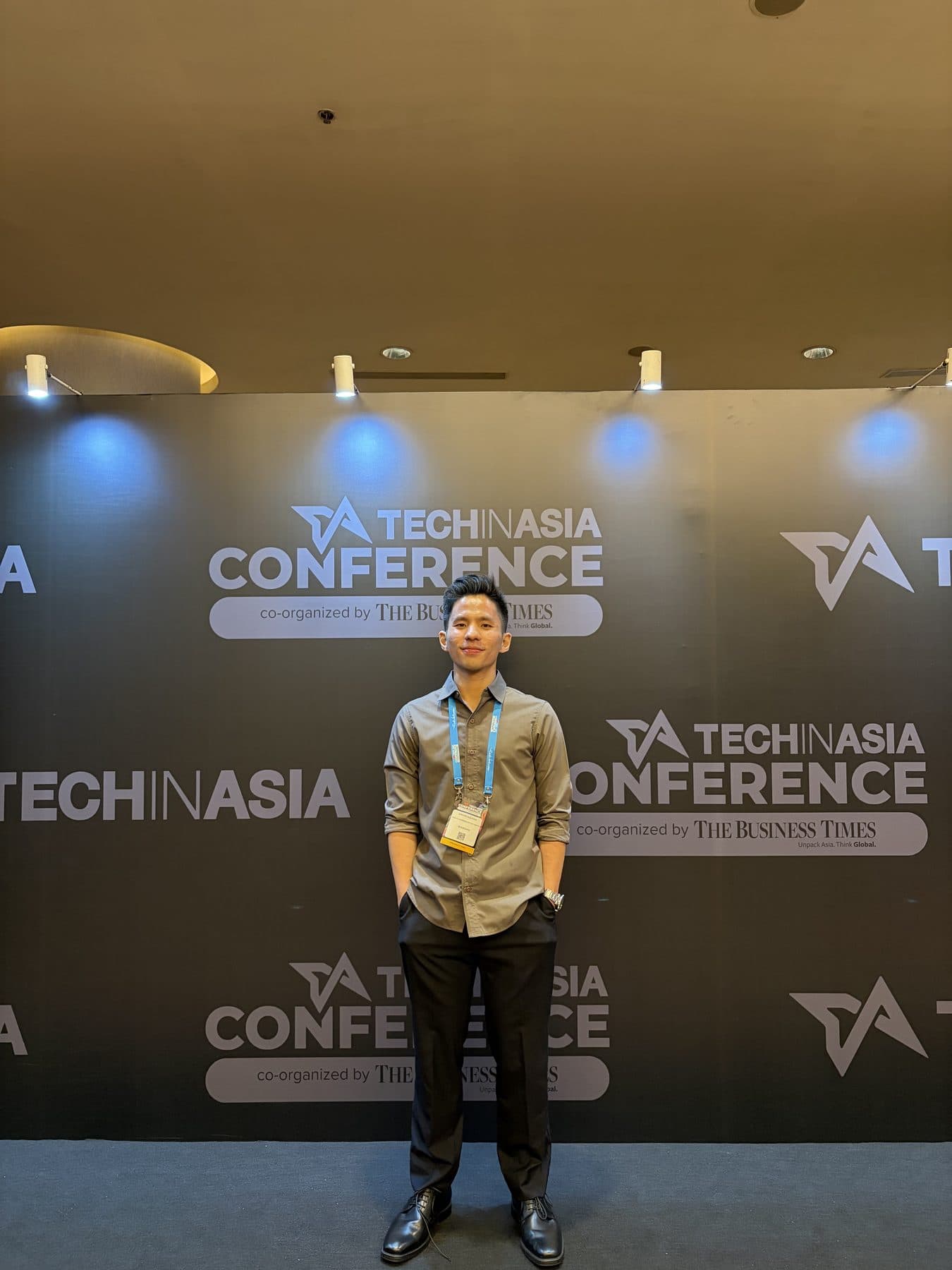 Edward in front of the Tech in Asia Conference wall