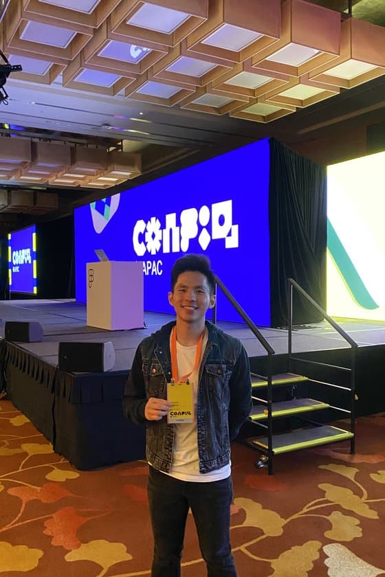 Edward at Config APAC with the conference stage behind him