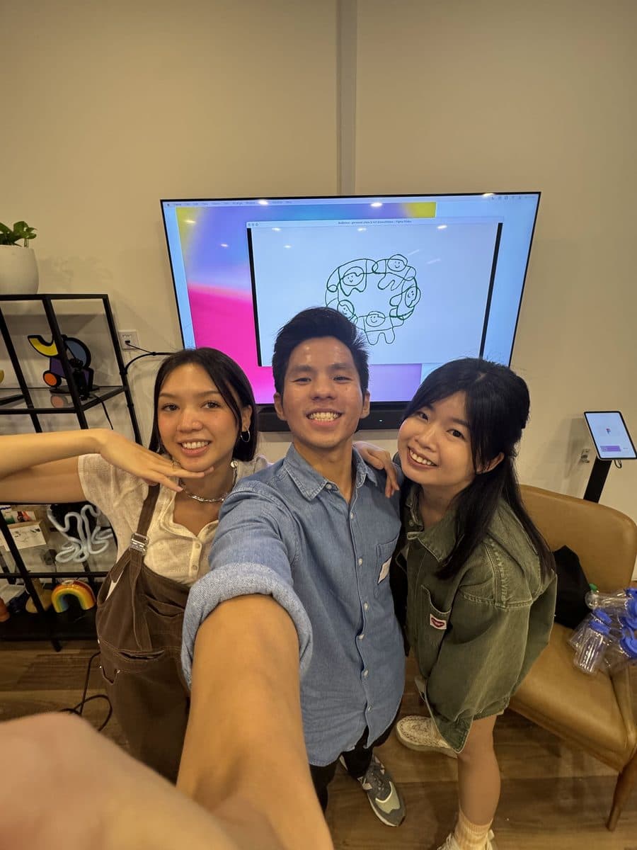 Edward with friends in a studio in front of a screen